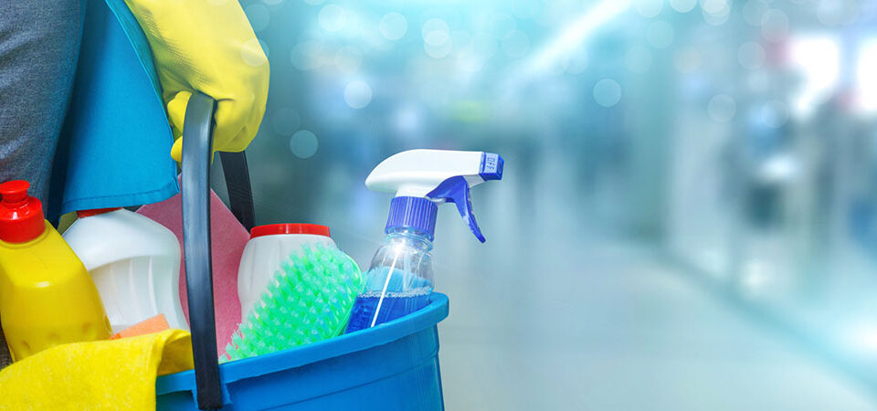 person lifting cleaning materials