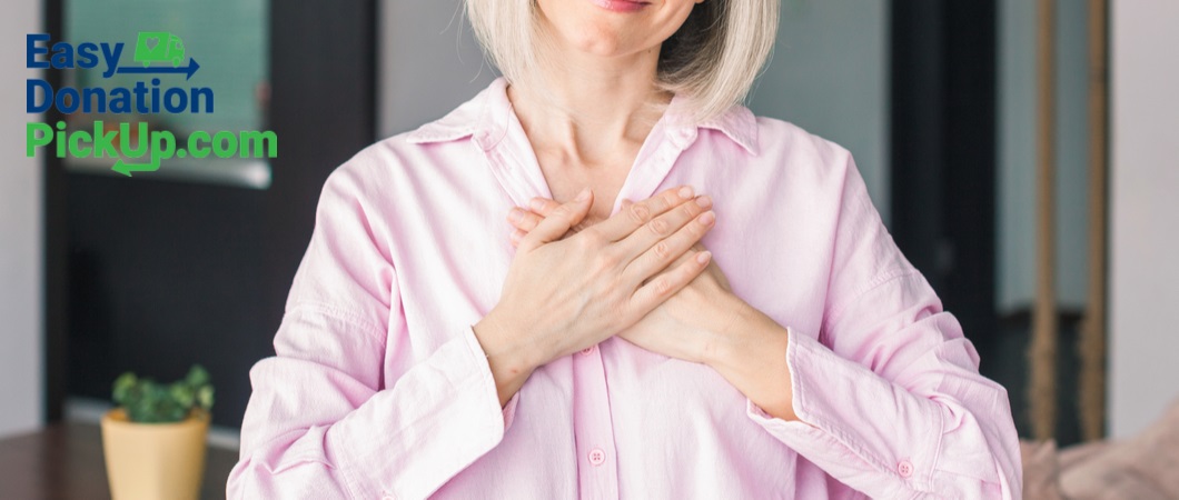 woman putting both of her hands close to her heart with easy donation pickup logo in the background