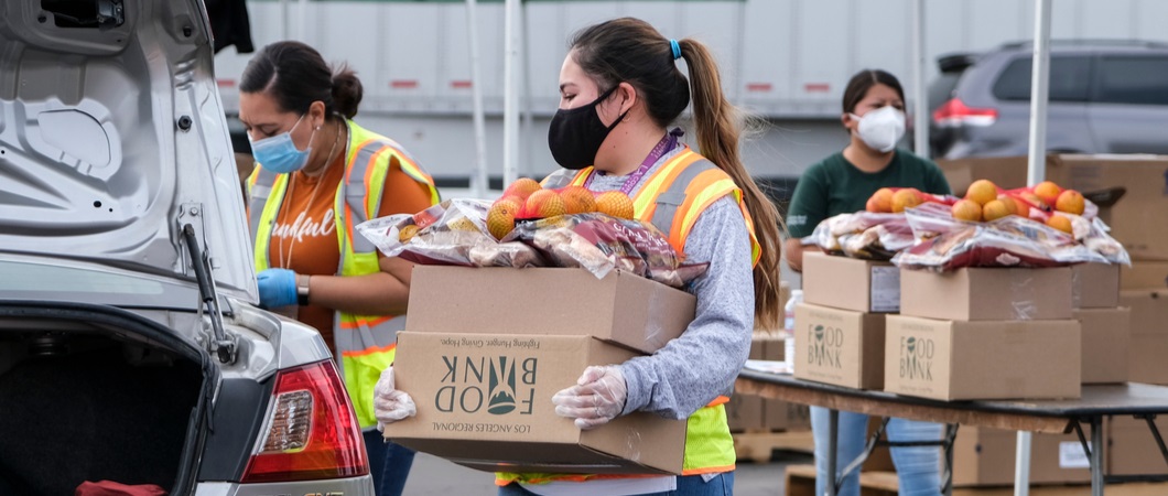 volunteers loading a truck with donated foods