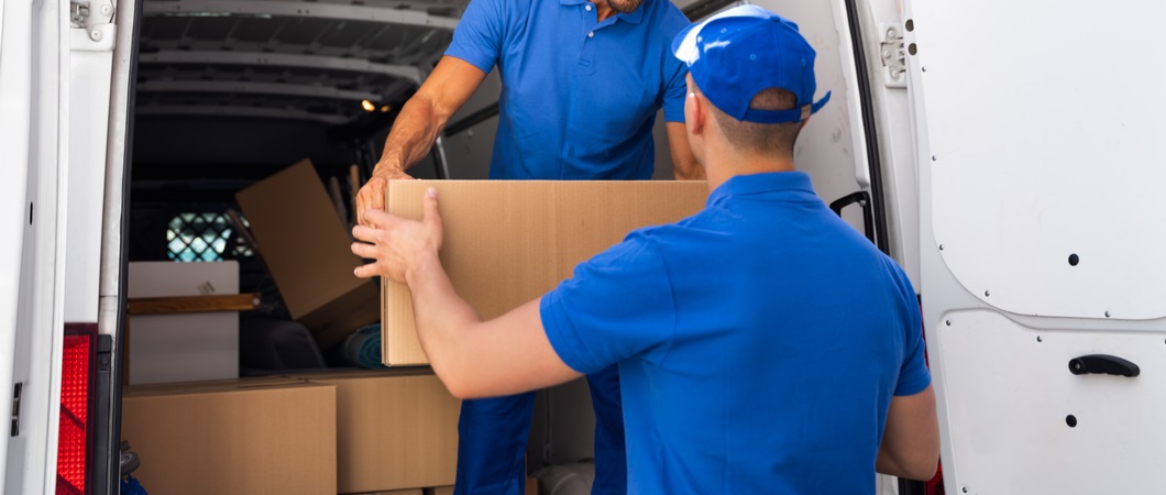 volunteers putting donations on a truck