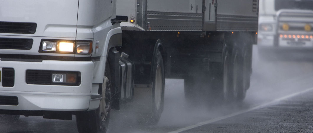 movers truck along a heavy rain weather