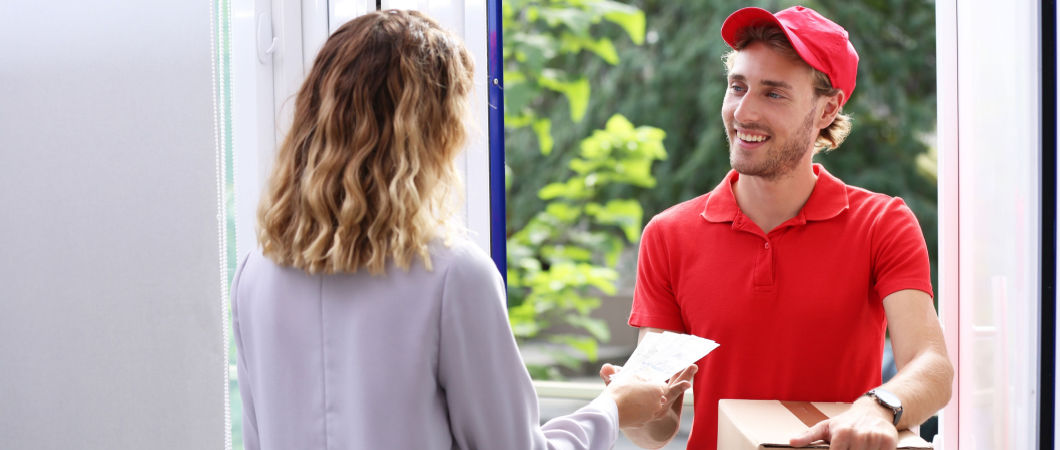woman giving tip to crew leader after moving