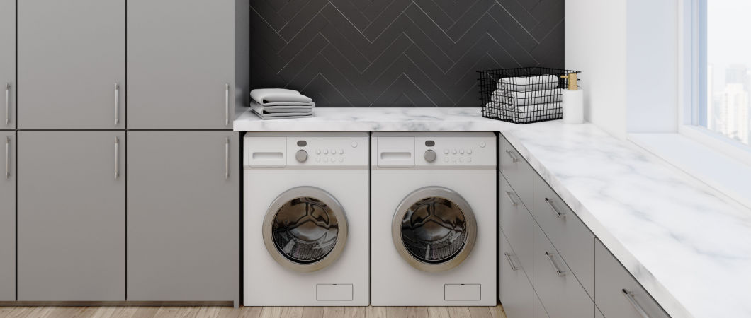 washing machine with countertop in gray laundry room