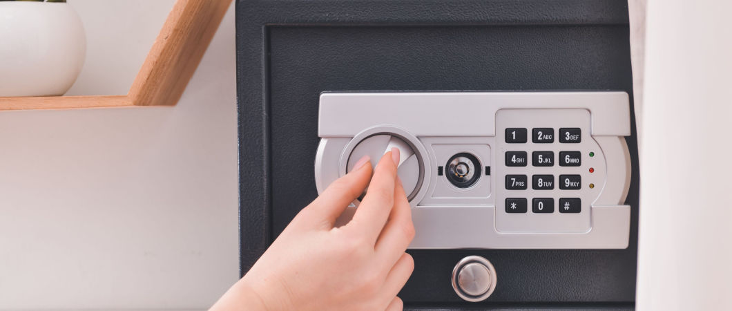 woman opening safety storage of important documents at home