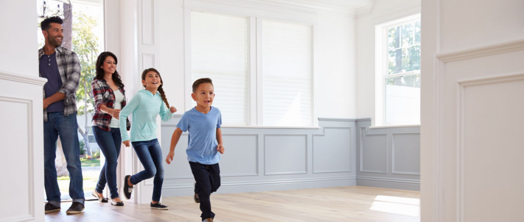 excited family explore new home on moving day