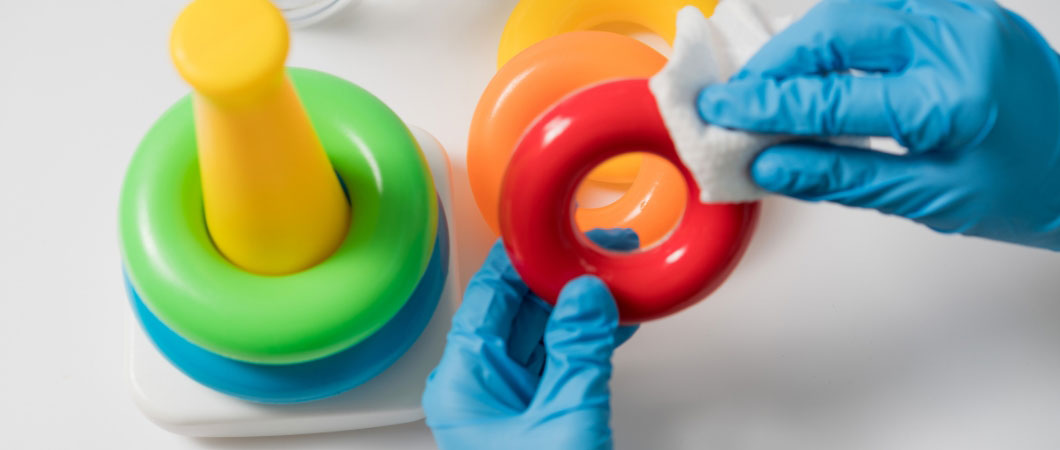volunteer cleaning and disinfecting toys