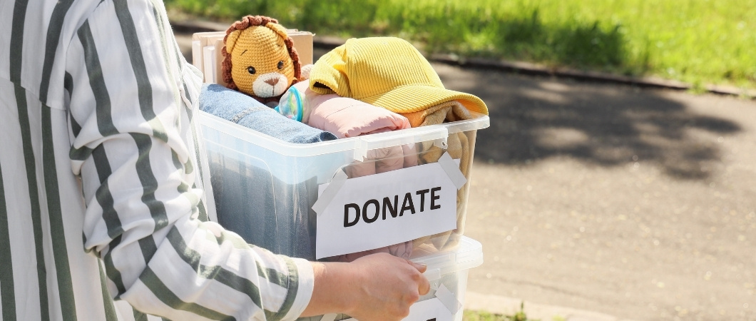toys clothing and other stuff in a box for donation