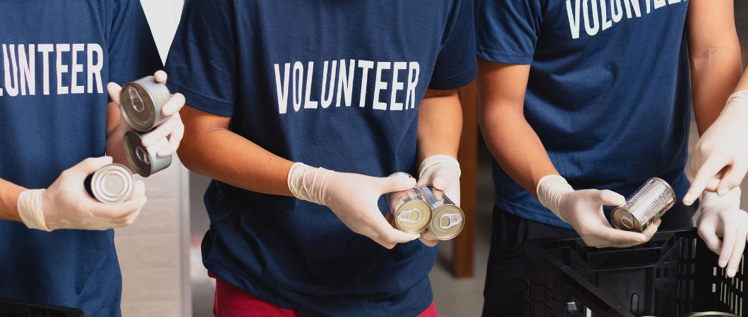 volunteers checking the donated canned food