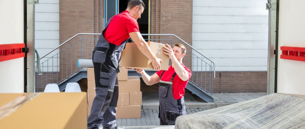 movers unloading the boxes in the truck
