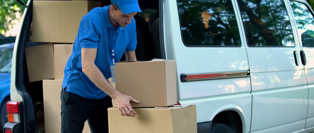 courier delivering moving boxes to customer