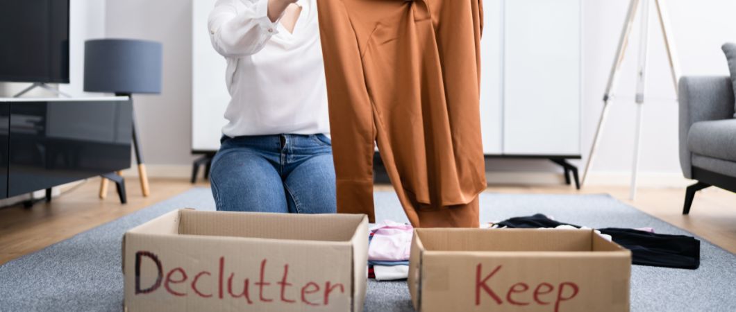 woman sorting unwanted clothes for donation