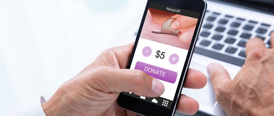 businessman donating money online on mobile phone