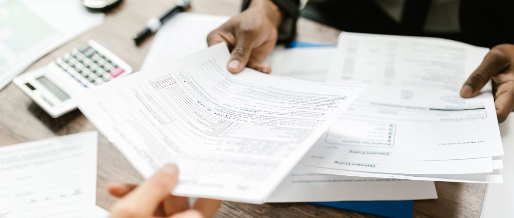 man handing out documents for donation tax deduction