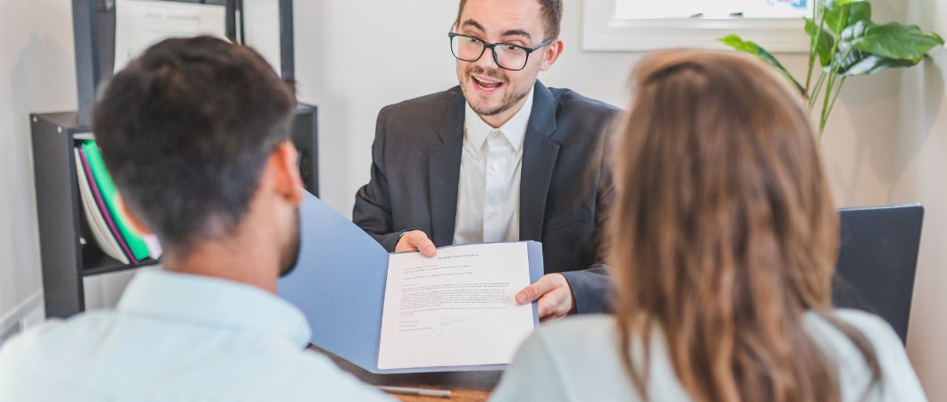 legal advisor helping couple for their real estate donation