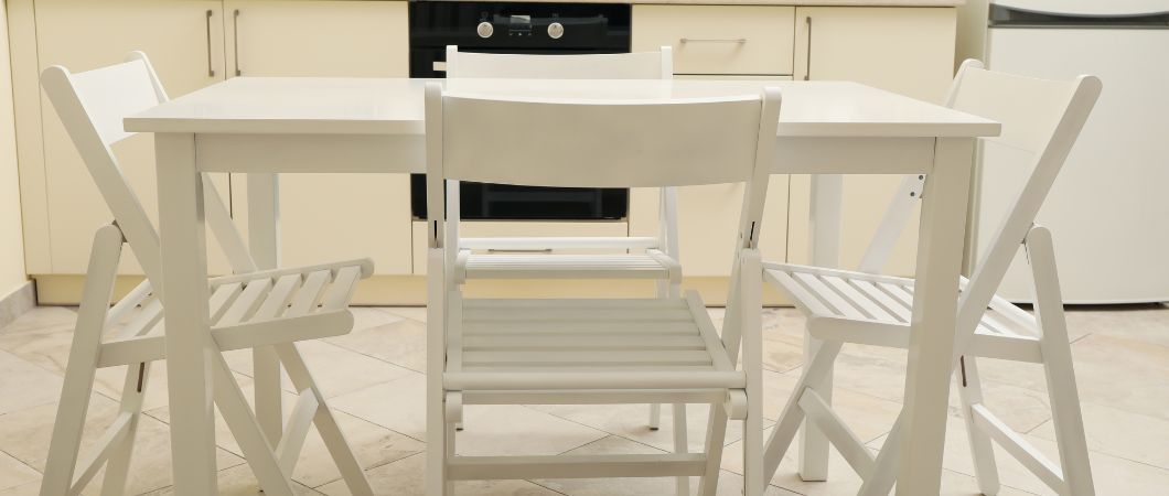 kitchen with wooden table and folding chairs