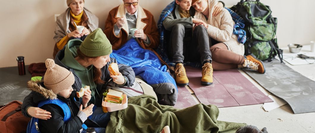 group of family eating in homeless shelter