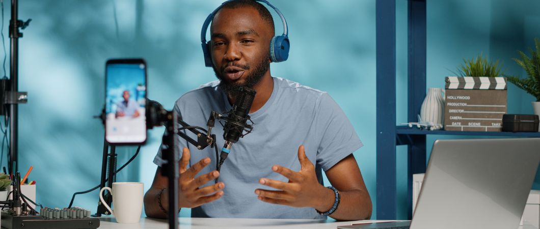 male volunteer recording video promoting charity