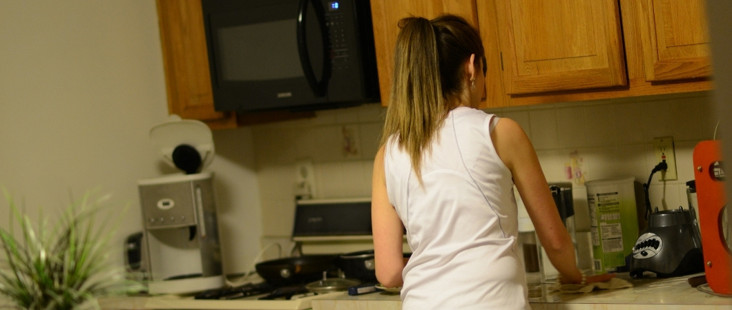 woman cleaning a pantry